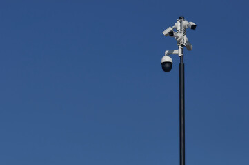 Video surveillance system against the blue sky.