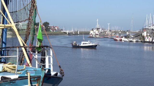 Fishing boat turning on the river at the harbor of Nieuwpoort, Belgium - static shot