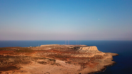 Aerial view of Cape Greco overlooking the mountain, Mediterranean sea and desert area at sunset, Cyprus photo by drone