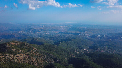 Fototapeta na wymiar Aerial view of the green hills at the foot of the Troodos mountains, Cyprus photo by drone
