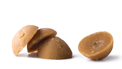 jaggery, golden brown color, cup shaped unrefined sugar product also called kithul jaggery or palm sugar,sweet and sugary traditional food in sri lanka and southeast asia, isolated on white background