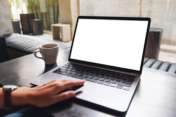 Mockup image of a woman using and touching on laptop touchpad with blank white desktop screen