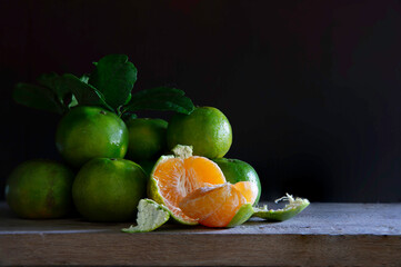 Still life of Fresh sweet tangerine on the wooden plank
