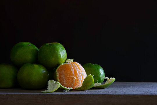 Still life of Fresh sweet tangerine on the wooden plank