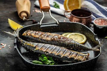 baked mackerel fish in a pan with lemon herbs and spices, banner, menu recipe place for text, top view