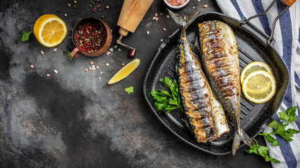baked mackerel fish in a pan with lemon herbs and spices, banner, menu recipe place for text, top...