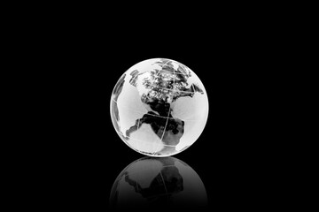 globe or earth is made of crystal ball on black background.