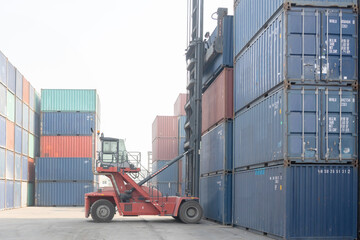 Crane Llifting Up Container in a Container Yard