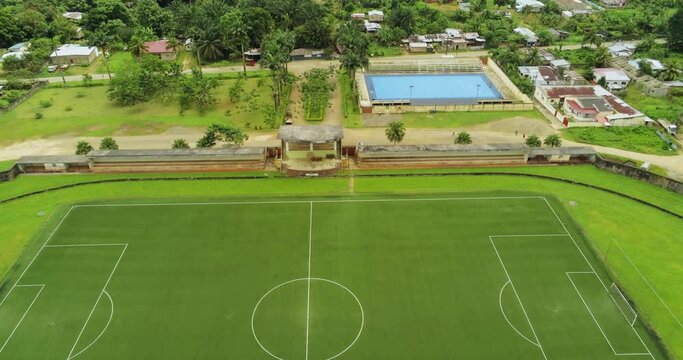 Aerial drone view over a soccer field, on the Ilha do Principe island