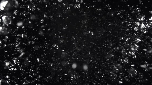 Underwater bubbles mayhem on Black Backgrounds. Illuminated bubbles motion. Ocean floor bubbles. Real underwater footage. Deep under sea level. Marine background VFX element.