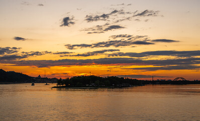 Fototapeta na wymiar Sunset on the Dnieper river in Kyiv, Ukraine