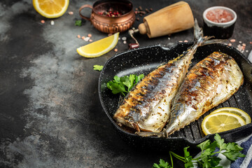 Baked mackerel, Japan dish fish in a pan with lemon herbs and spices, banner, menu recipe place for text, top view