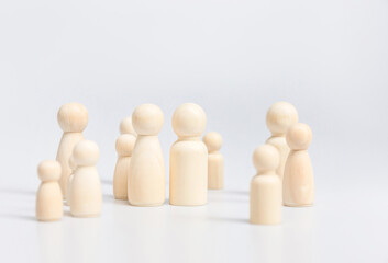 Group of wooden figures family on white background