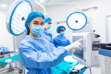 Diverse Team of Professional Surgeons Performing Invasive Surgery on a Patient in the Hospital...