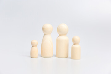 Group of wooden figures family on white background