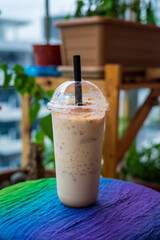 Iced blended caramel coffee topped with crushed caramel biscoff in plastic glass. Hot season...