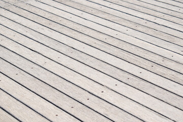 Old wood board floor pavement with screws background. Perspective view.