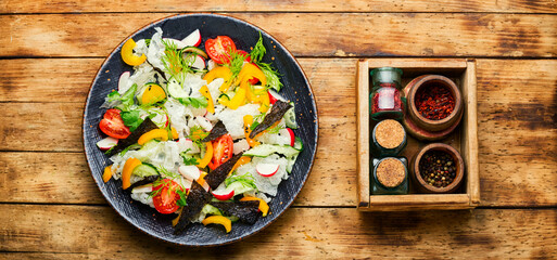 Vegetable salad decorated with rice paper