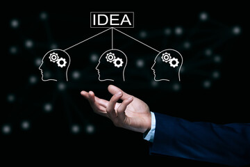 man holding idea and people gears icon