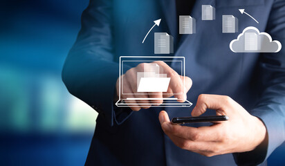 man holding phone with file cloud icon
