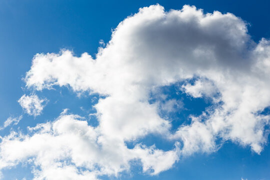 white fluffy clouds in the blue sky