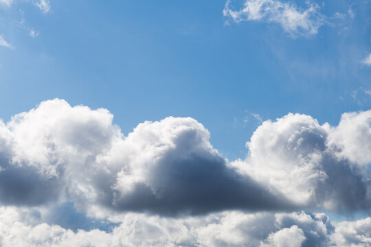 rain clouds on a blue sky background