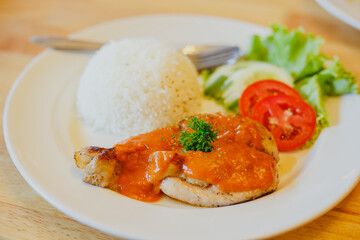 Rice with chicken steak on a plate restaurant cafe