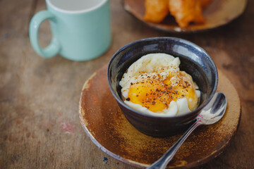 Soft-boiled eggs on color wooden background