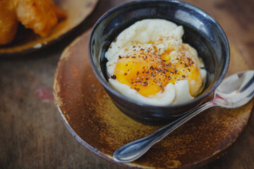 Soft-boiled eggs on color wooden background