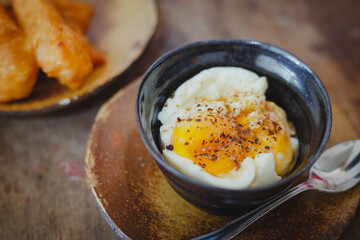 Soft-boiled eggs on color wooden background