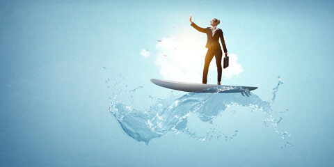 Businesswoman standing on surfing board and making selfie. . Mixed media