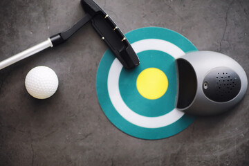 Sport and healthy lifestyle. Mini golf. White golf ball and set for minigolf on the table. Sports background with golf concept.