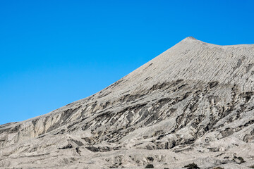 Bromo mountain crater near Batok volcano. Bromo is an active volcano and Tengger massif in Tengger caldera in East Java, Indonesia. Bromo Tengger Semeru National Park. Viewpoint from desert.