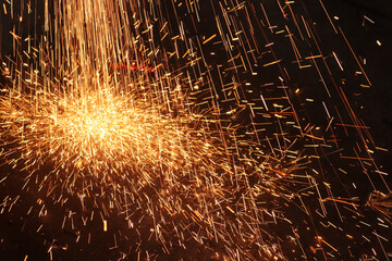 Glowing sparks abstract background texture.