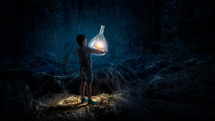 Boy holding glass flask with landscape inside it . Mixed media