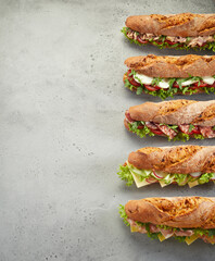Row of fresh sandwiches on table - 430085941