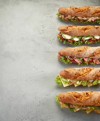 Selbstklebende Fototapeten Row of fresh sandwiches on table © exclusive-design