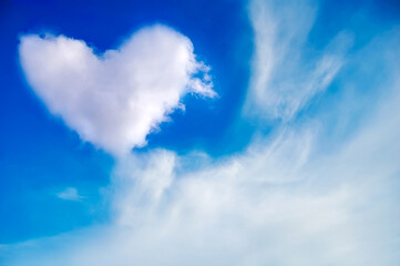 Naklejka na ściany i meble Abstract heart in blue sky.