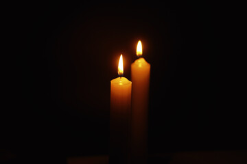 Burning candle Wick from a candle in a flame of fire. Symbol of sadness and loneliness. A time of condolences. Burning wax candle. Religion.