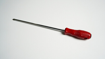 Red screwdriver on white background.