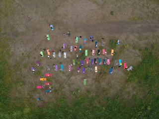 Aerial view of yoga class on the green grass outdoor