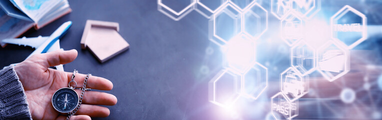 Travel concept. Magnetic compass in the hand. Retro navigator in hand a map and airplane...