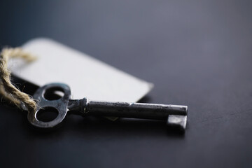 Set of vintage keys for a lock. Retro keys on a dark stone background. The concept of choosing the path to achieve the goal.