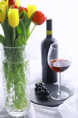 Glass with grape red semi-dry wine. Valentine's day concept background. Gift for the holiday. Sweet sparkling wine.