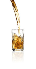 Pouring whiskey into shot glass on white background