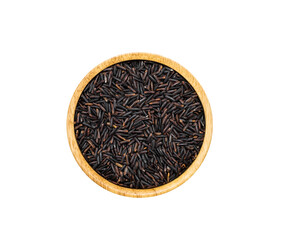 Uncooked dry Riceberry purple rice in wooden bowl on white background, top view.