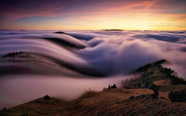 Sunset in the autumn mountains above the clouds during the weather inversion Fatra mountains in...