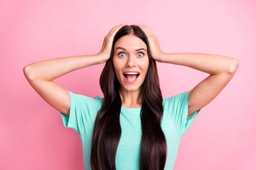Fototapeta premium Photo of young attractive excited happy positive amazed girl hold hands head isolated on pink color background