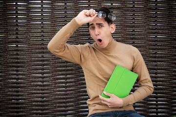 Funny young man with laptop. Freelancer and web design. Business strategy. Online training in the...