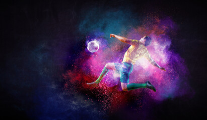 Obraz na płótnie Canvas Boy playing soccer hitting the ball
